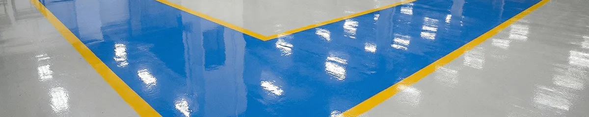 A factory floor professionally covered and marked with epoxy flooring in Mesa, AZ
