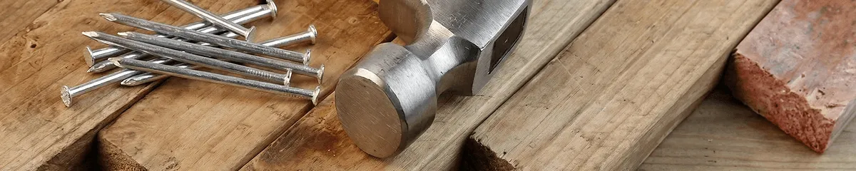 Hammer and nails on hardwood flooring boards in Mesa, AZ