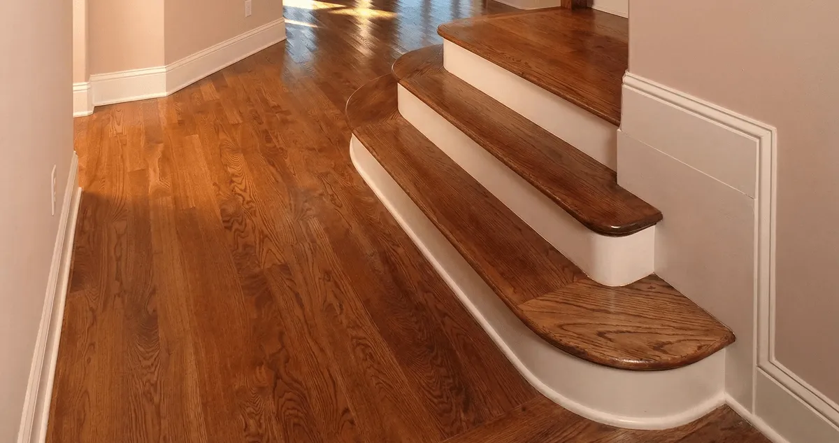 Base floor of a staircase with professionally restored wood flooring in Mesa AZ