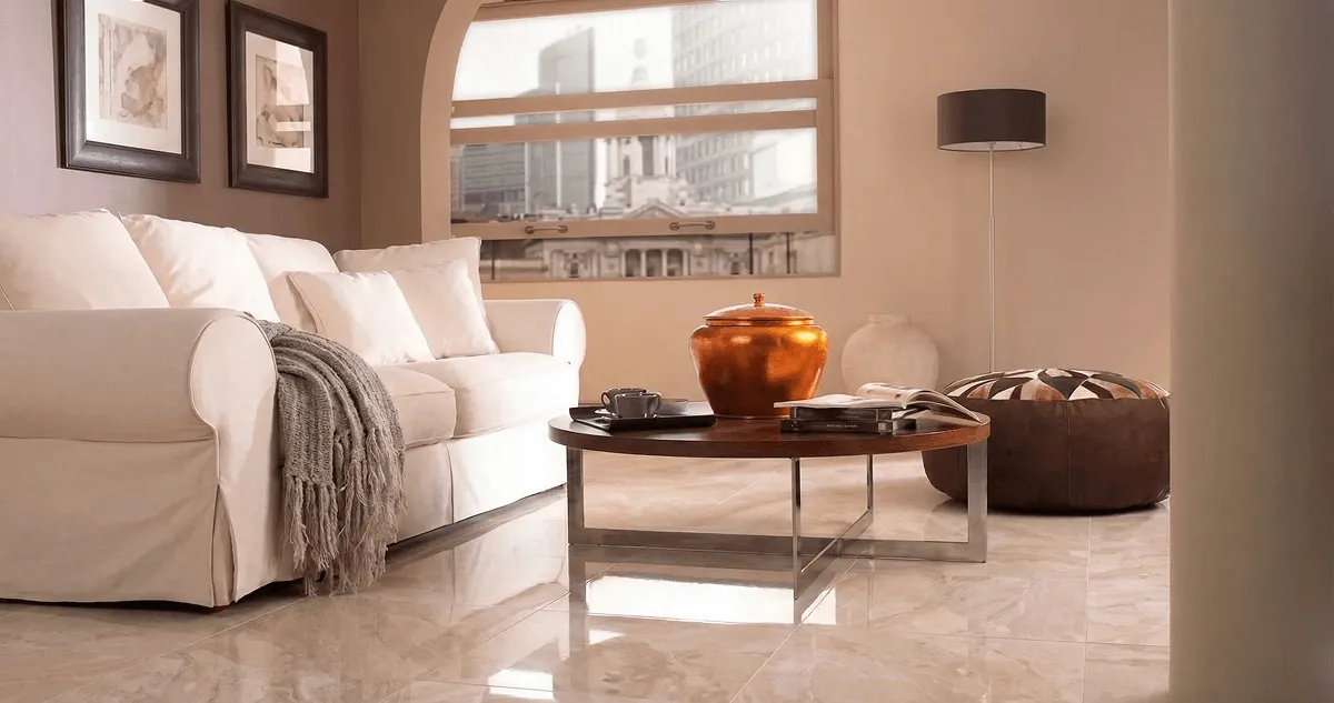 Modern living room with professionally installed marble flooring, a beige sofa, coffee table in Mesa, AZ