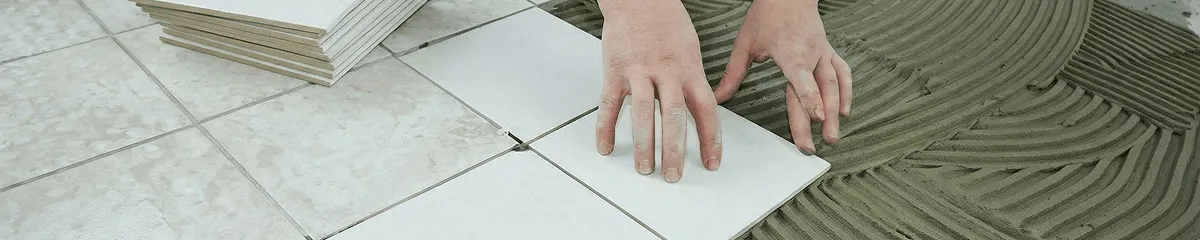 Professional installing white tile floors in Mesa, AZ