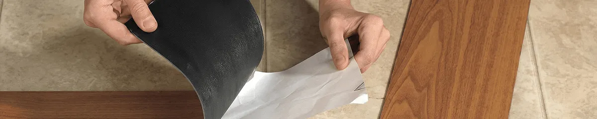 A professional installing vinyl flooring in Mesa, AZ